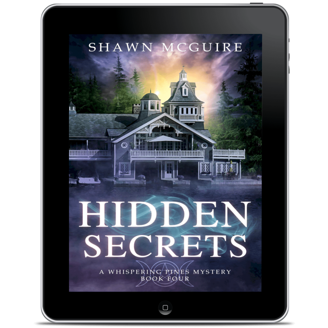 Tablet displaying the book cover of 'Hidden Secrets' by Shawn McGuire
