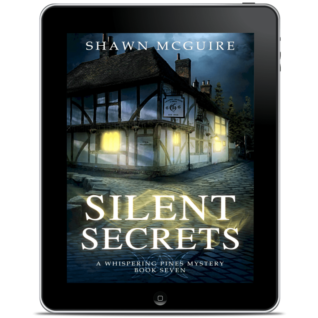 Tablet displaying the ebook cover of 'Silent Secrets' by Shawn McGuire