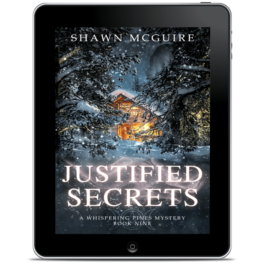 Tablet displaying the book cover of 'Justified Secrets' by Shawn McGuire