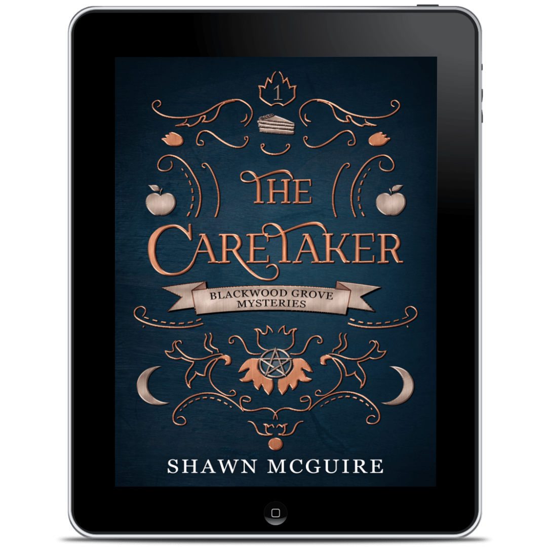 Tablet displaying the book cover of 'The Caretaker' by Shawn McGuire