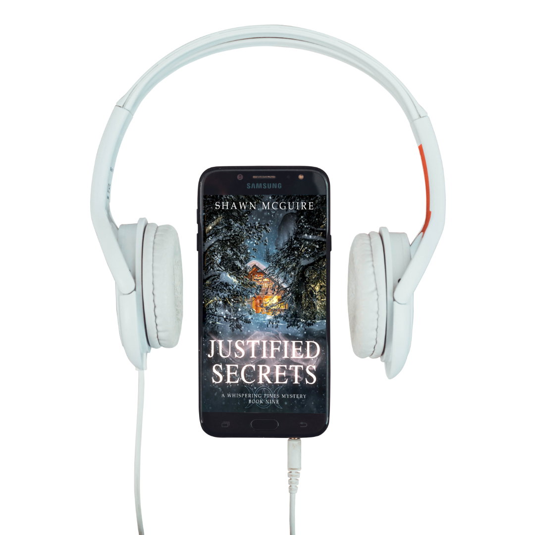 Audiobook cover on cellphone of Shawn McGuire's cozy murder mystery featuring a cabin in the woods during a snowstorm.