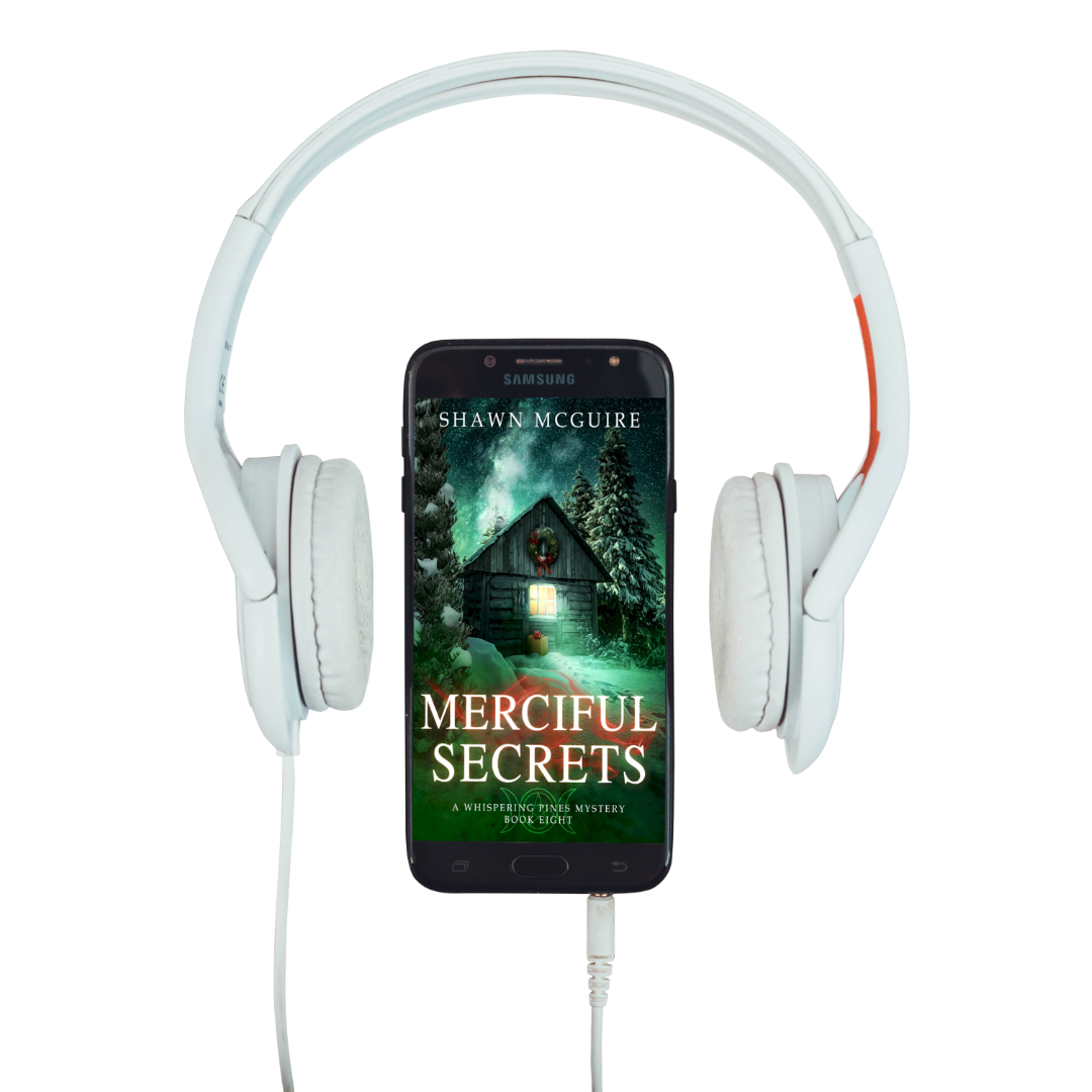 E-book cover on e-reader of Shawn McGuire's cozy murder mystery featuring a cabin in the woods during Yule.