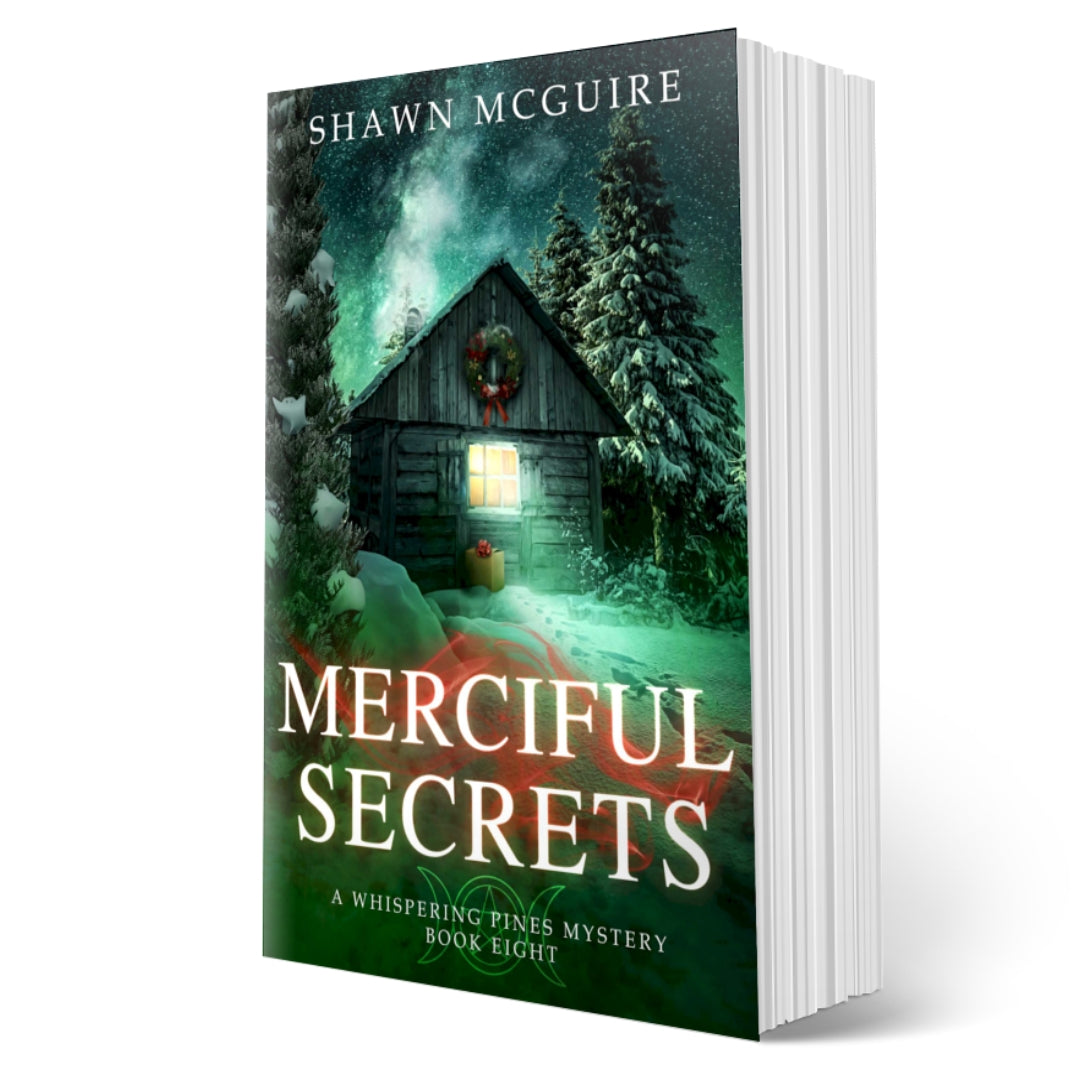 Cover of Shawn McGuire's cozy murder mystery featuring a cabin in the woods during Yule.