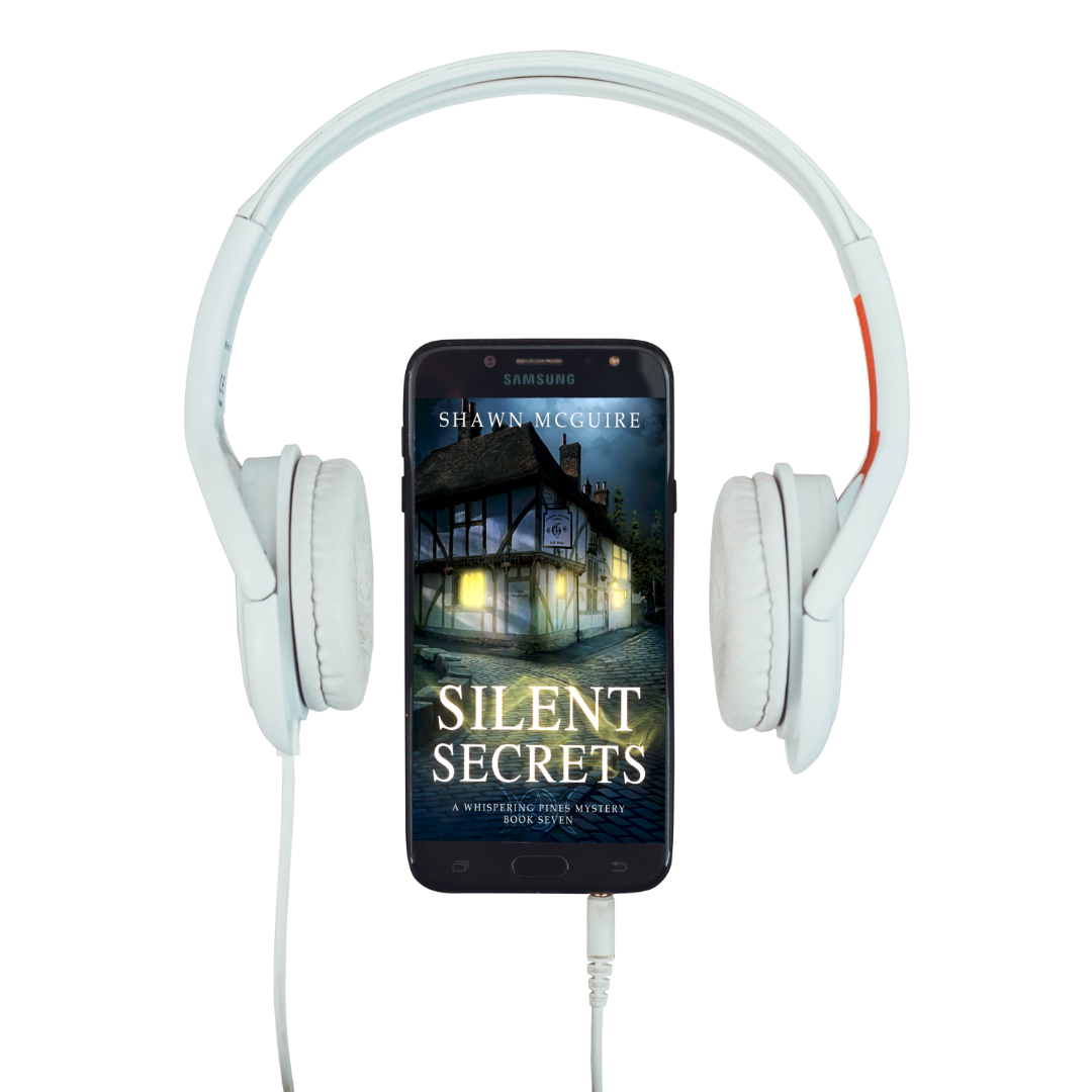 Audiobook cover on cellphone of Shawn McGuire's cozy murder mystery featuring a pub on a cobbled pathway.