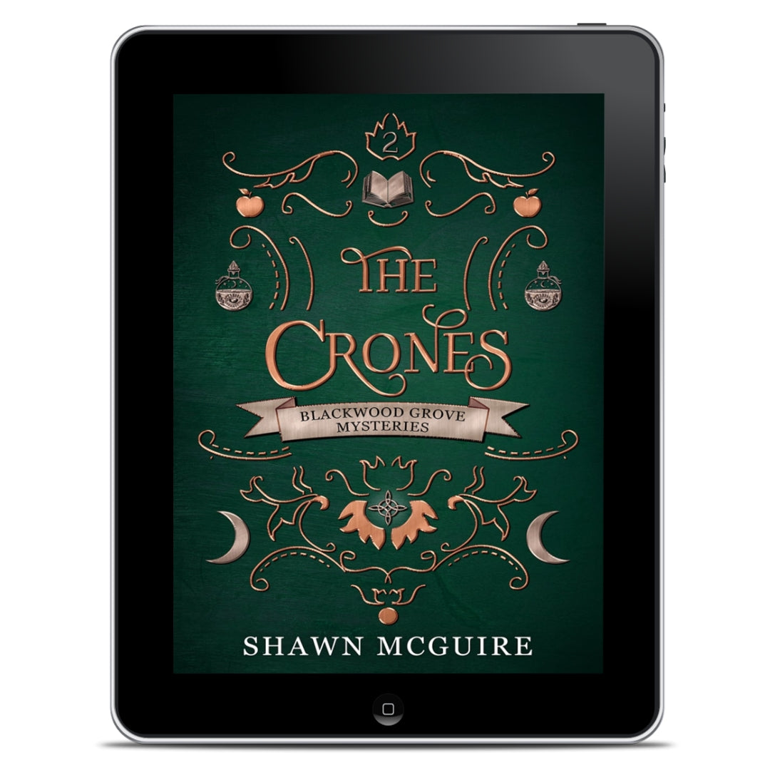 E-book cover on e-reader of Shawn McGuire’s witch cozy paranormal midlife mystery series green background with scrollwork and grimoire, moons, and potion bottles icons.