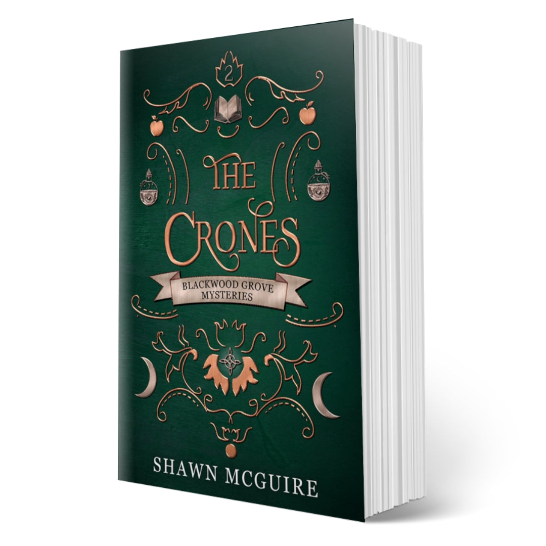 Cover of Shawn McGuire’s witch cozy paranormal midlife mystery series green background with scrollwork and grimoire, moons, and potion bottles icons.