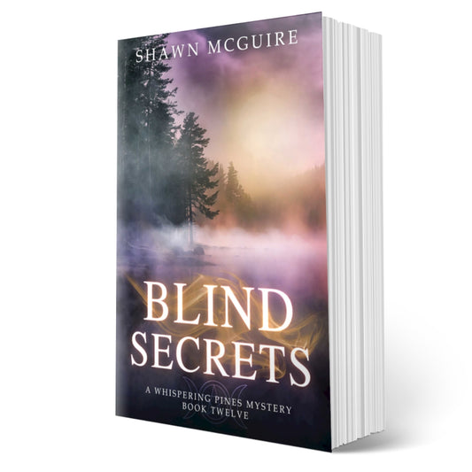 Cover of the paperback version of Shawn McGuire's cozy murder mystery series set in Whispering Pines, featuring a lake shrouded in fog.