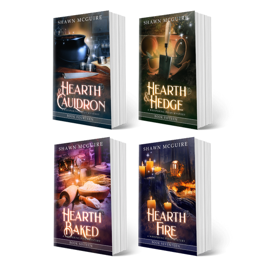 Book covers for books 14-17 of the Whispering Pines Mysteries series by Shawn McGuire on a white background