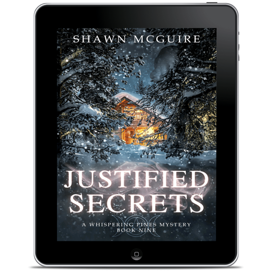 Tablet displaying the book cover of 'Justified Secrets' by Shawn McGuire 
