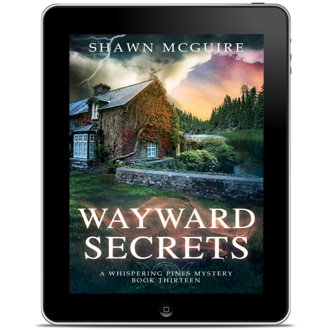Tablet displaying the book cover of 'Wayward Secrets' by Shawn McGuire 
