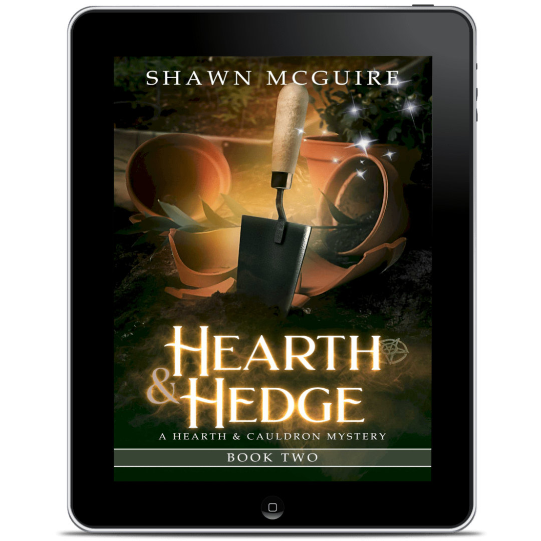 Digital book cover of 'Hearth & Hedge' by Shawn McGuire displayed on a tablet.