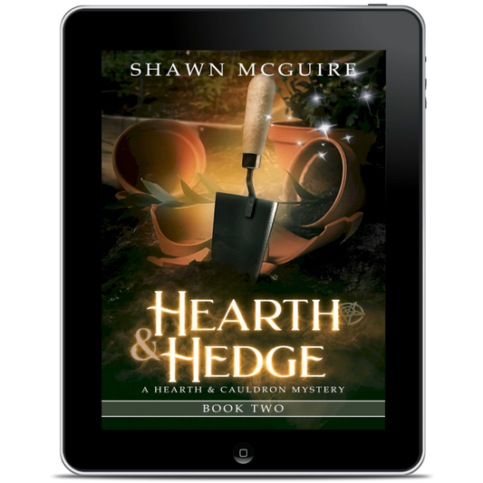 Digital book cover of 'Hearth & Hedge' by Shawn McGuire displayed on a tablet.