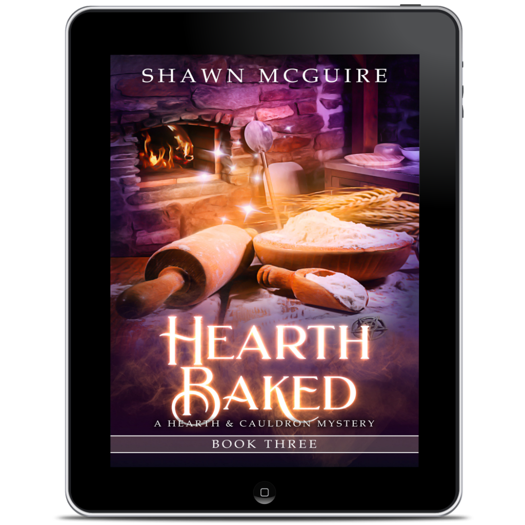 Digital book cover of 'Hearth Baked' by Shawn McGuire displayed on a tablet.