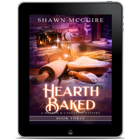 Digital book cover of 'Hearth Baked' by Shawn McGuire displayed on a tablet.
