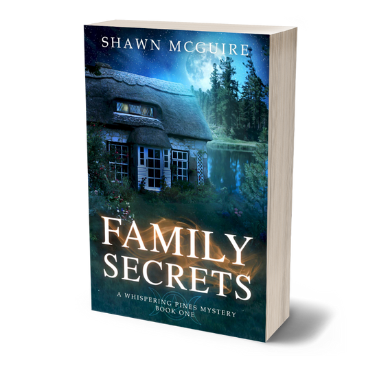 Paperback cover of 'Family Secrets' by Shawn McGuire with a house and moonlit sky on the cover.