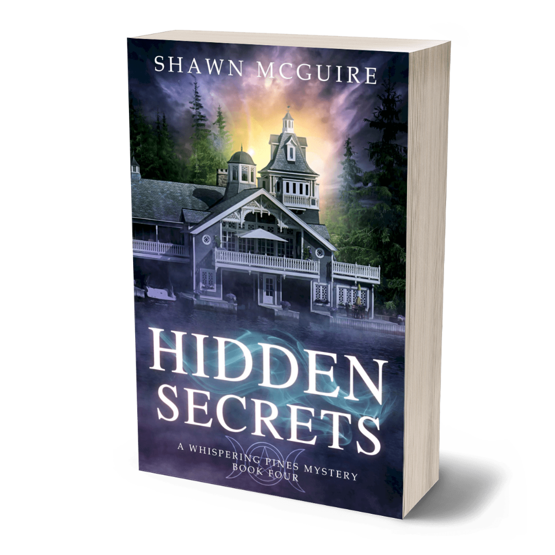 Book cover of 'Hidden Secrets' by Shawn McGuire with a house and trees on the cover.