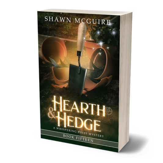 Book cover of 'Hearth & Hedge' by Shawn McGuire with a shovel and pot on a dark background.