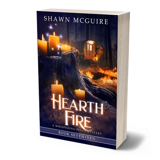 Book cover of 'Hearth Fire' by Shawn McGuire with candles on a log with fire in background.