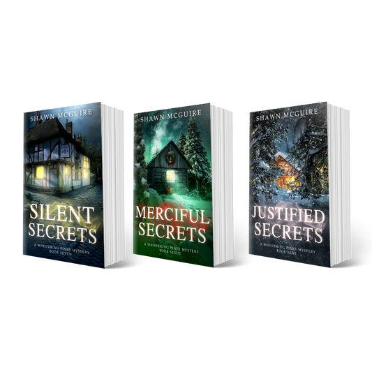 Three book covers of 'Silent Secrets', 'Merciful Secrets', and 'Justified Secrets' by Shawn McGuire.