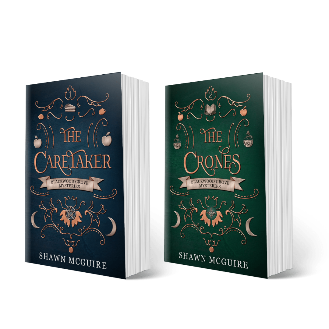 Two books titled 'The Caretaker' and 'The Crones' from The Witches of Blackwood Grove paranormal mystery series by Shawn McGuire on a white background.