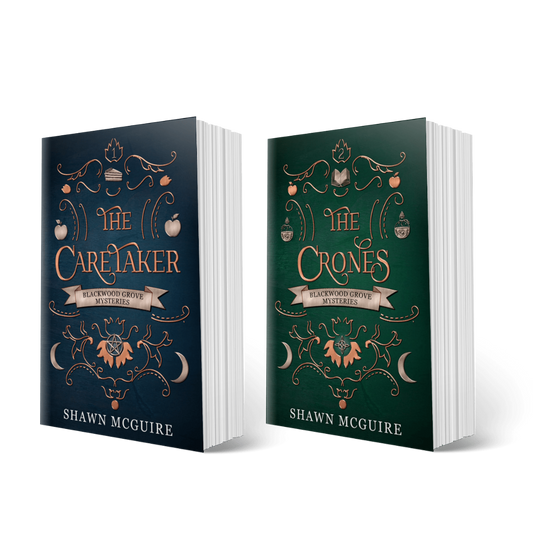 Two books titled 'The Caretaker' and 'The Crones' from The Witches of Blackwood Grove paranormal mystery series by Shawn McGuire on a white background.