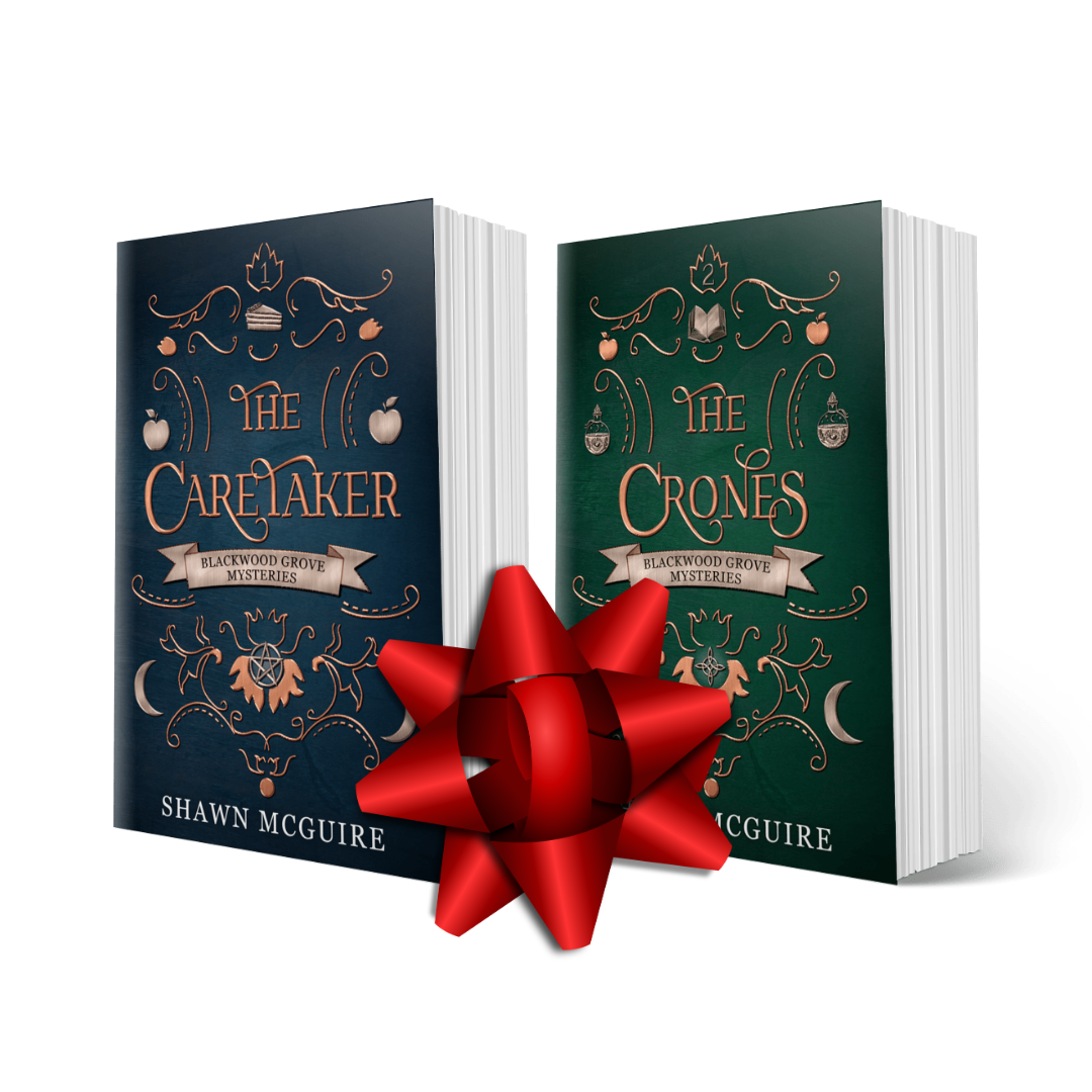Two books titled 'The Caretaker' and 'The Crones' from Shawn McGuire's Witches of Blackwood Grove paranormal mystery series with a red bow between them on a white background.