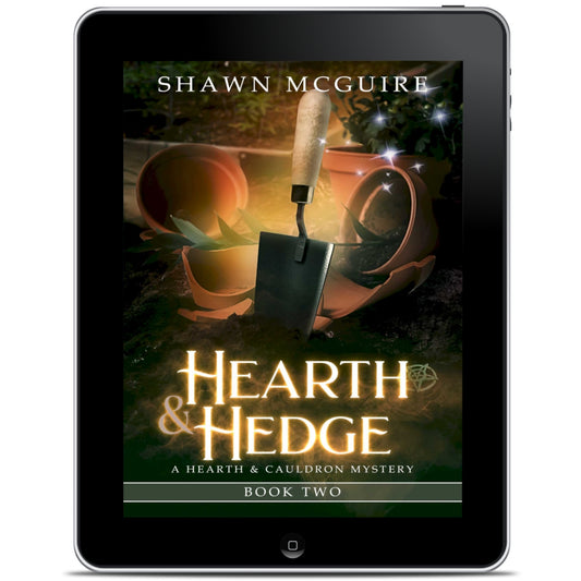 E-book cover on e-reader of Shawn McGuire’s witch cozy midlife mysteries with broken plant pots and a hand trowel. 