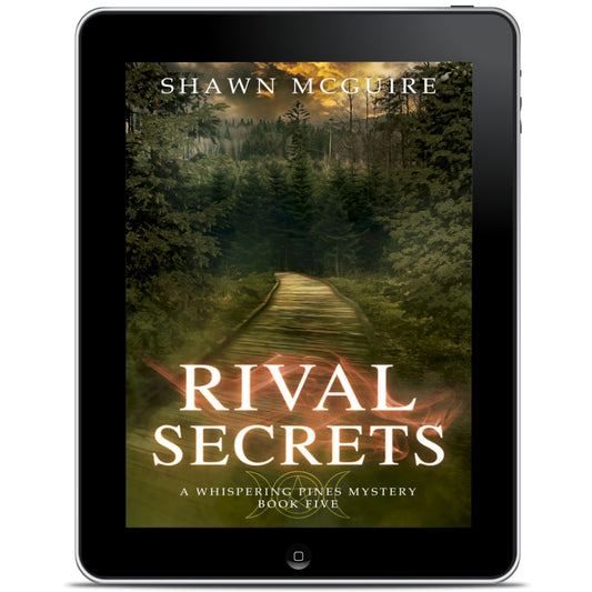 E-book cover on e-reader of Shawn McGuire's cozy murder mystery with a wood pathway leading into a dark, dangerous forest.