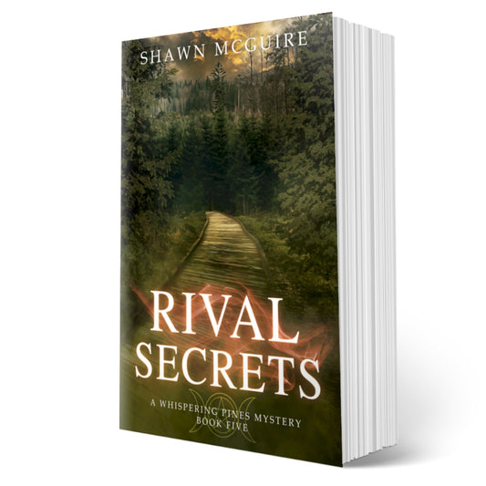 Cover of Shawn McGuire's cozy murder mystery with a wood pathway leading into a dark, dangerous forest.