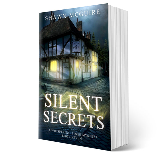 Cover of Shawn McGuire's cozy murder mystery featuring a pub on a cobbled pathway.