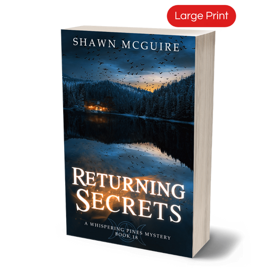 Large print paperback titled 'Returning Secrets' by Shawn McGuire with a lake, pine forest, and flock of crows on cover.