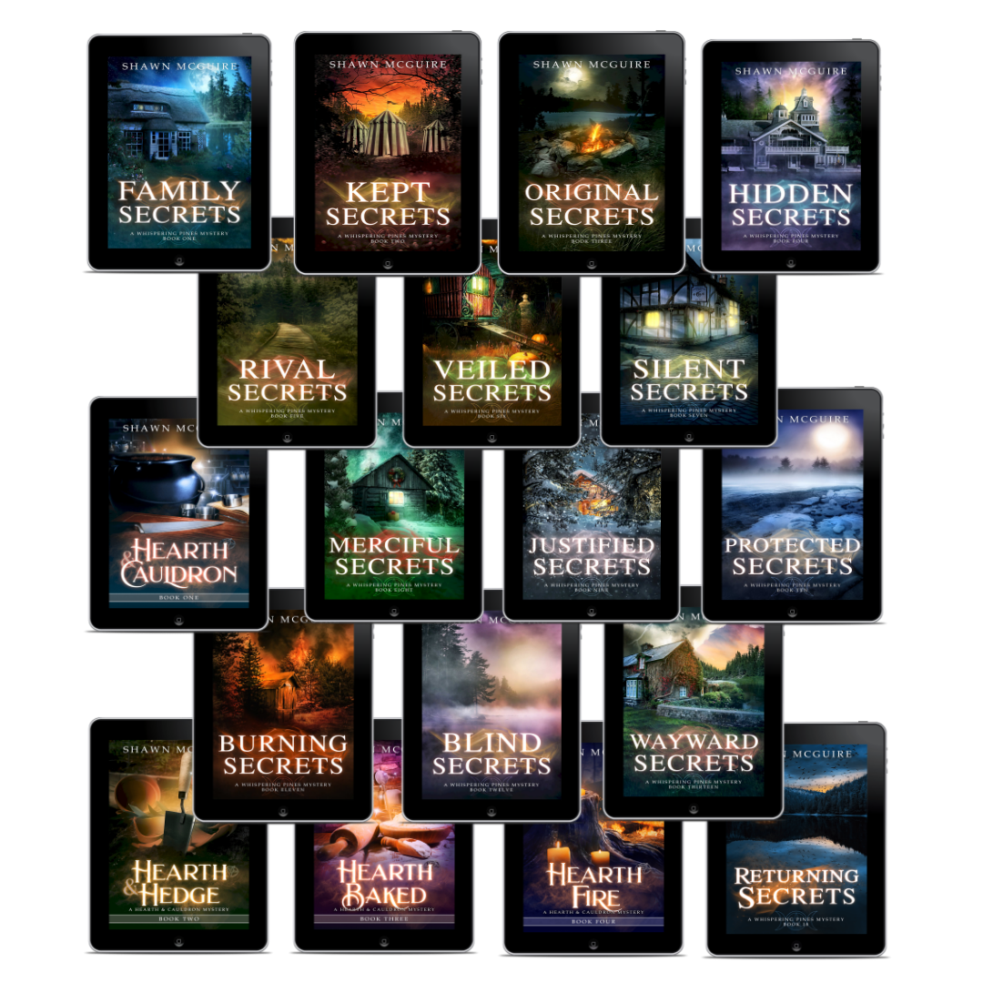 Collection of book covers from the Whispering Pines mysteries series by Shawn McGuire on e-reader devices.