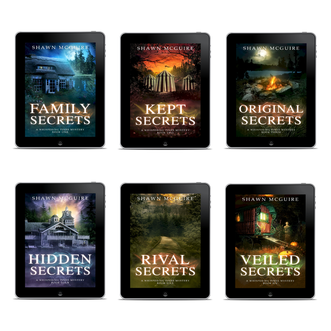 Six book covers of Whispering Pines mysteries series by Shawn McGuire on digital devices.