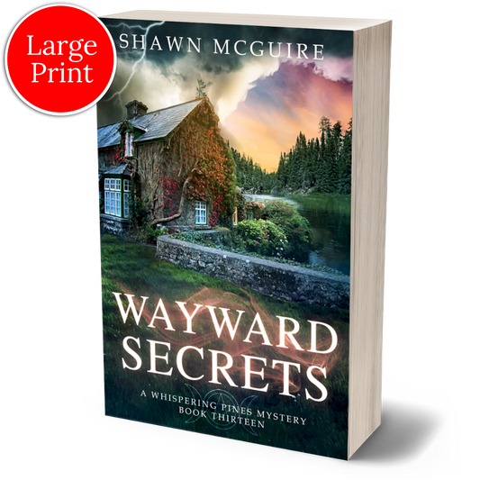 Large print paperback cover of Shawn McGuire's cozy murder mystery featuring a stone cottage on a lake beneath an ominous sky.