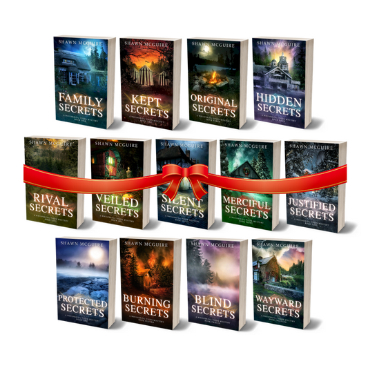 Collection of 'Secrets' book series by Shawn McGuire with colorful covers on a white background with a red gift bow.