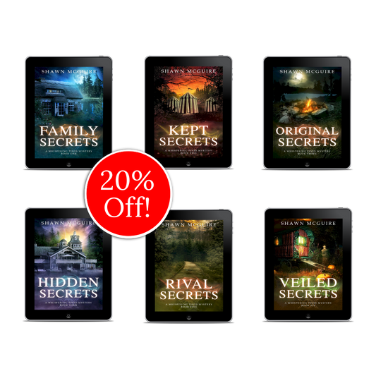 E-book covers on e-readers of Shawn McGuire’s 13-book cozy murder mystery series collection books 1-6.