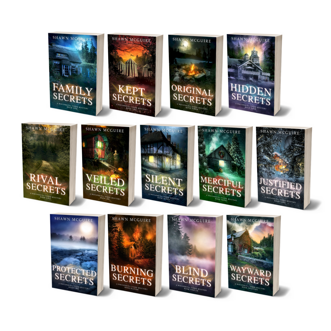 Paperback covers of Shawn McGuire 13-book cozy murder mystery series collection.