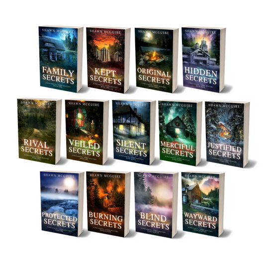Paperback covers of Shawn McGuire 13-book cozy murder mystery series collection.
