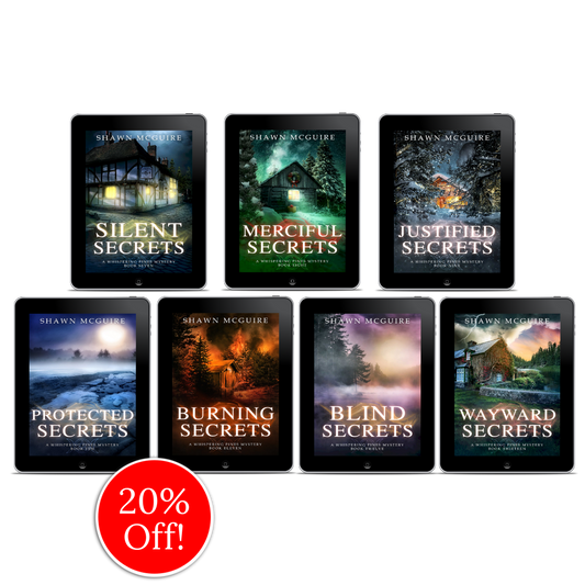 E-book covers on e-readers of Shawn McGuire’s 13-book cozy murder mystery series collection books 7-13.